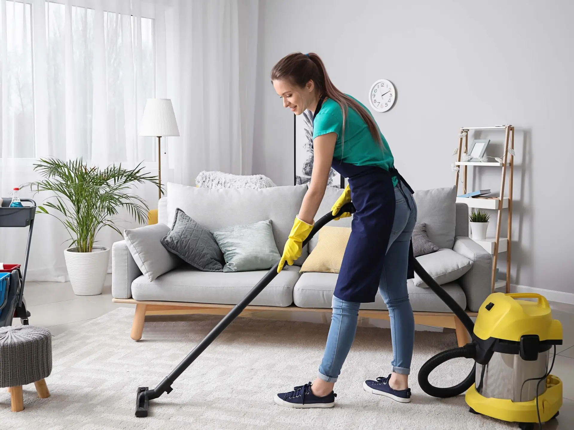 SDN cleaner vacuuming the living room of a Sydney home